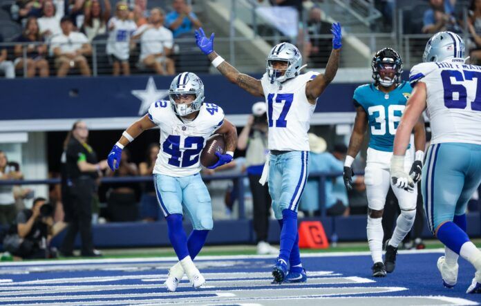 Dallas Cowboys RB Deuce Vaughn (42) celebrates with teammates after scoring a touchdown against the Jacksonville Jaguars.