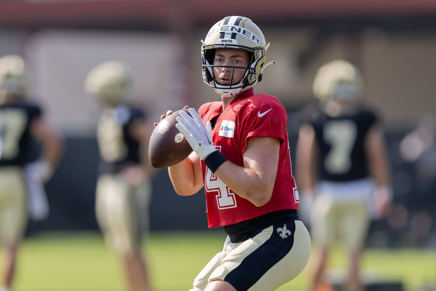 New Orleans Saints QB Jake Haener (14) throws a pass at training camp.