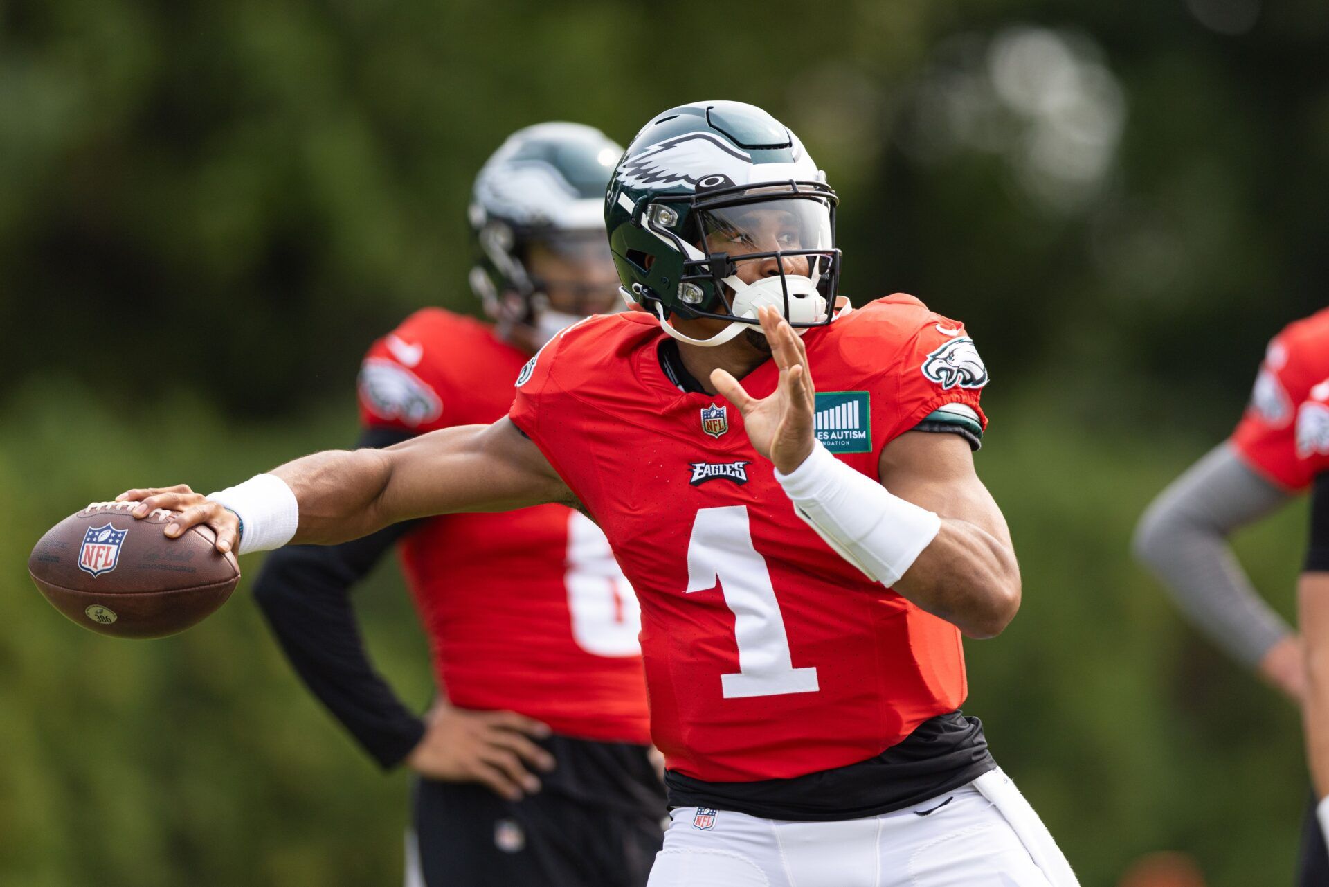 Jalen Hurts (1) throws the ball during practice at Novacare Complex.