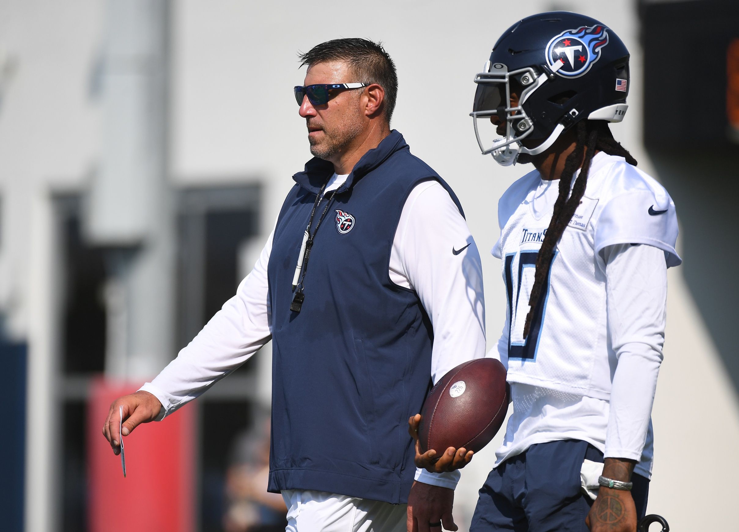 DeAndre Hopkins (10) talks with head coach Mike Vrabel before the start of training camp.