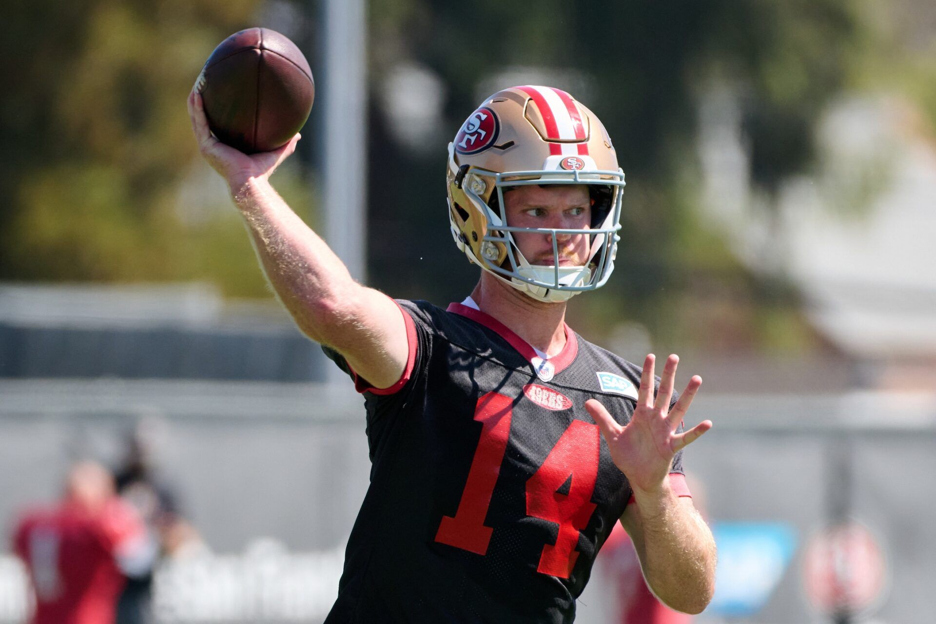 Sam Darnold (14) throws a pass during training camp at the SAP Performance Facility.