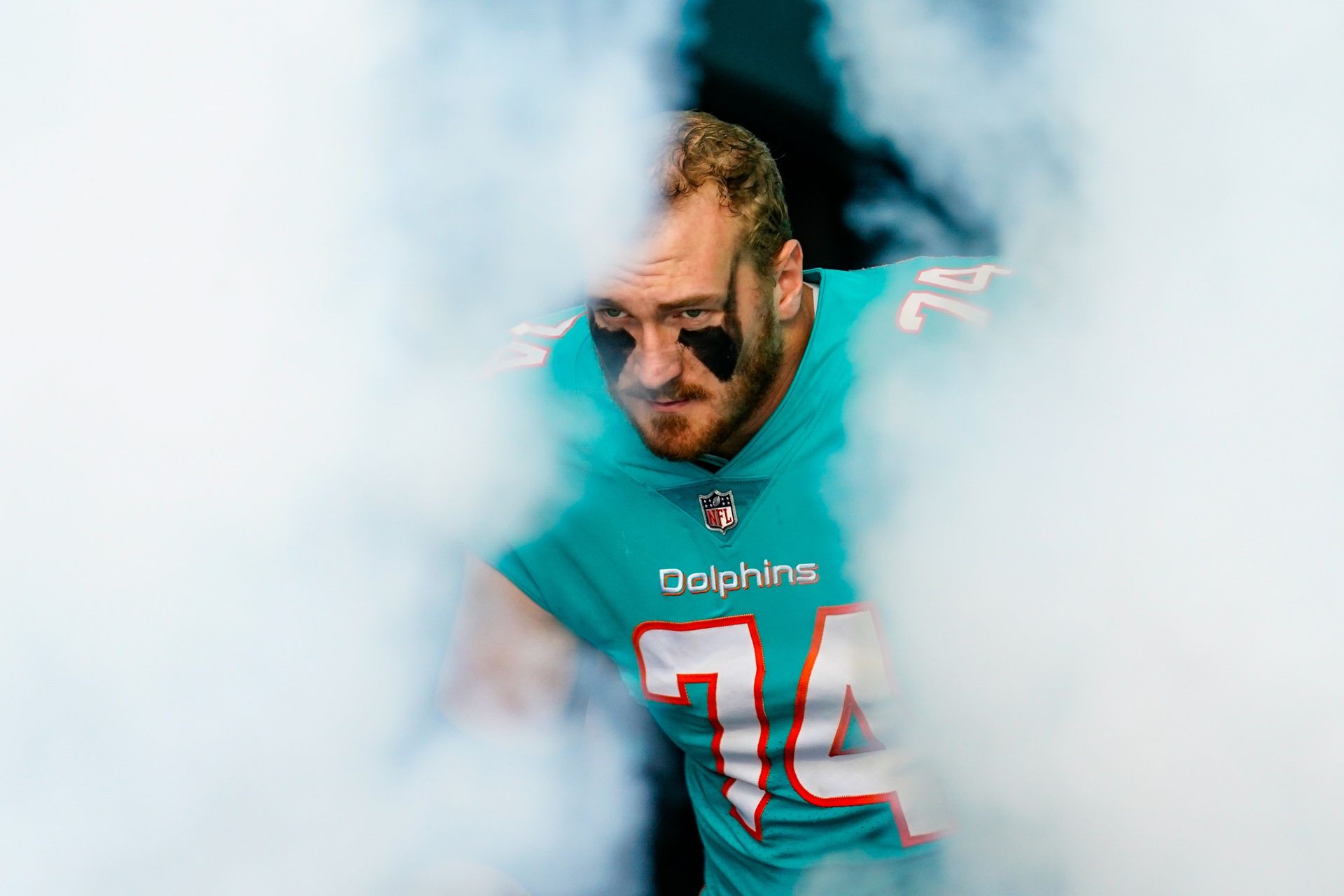 Liam Eichenberg (74) enters the field prior to a game against the New York Jets at Hard Rock Stadium.