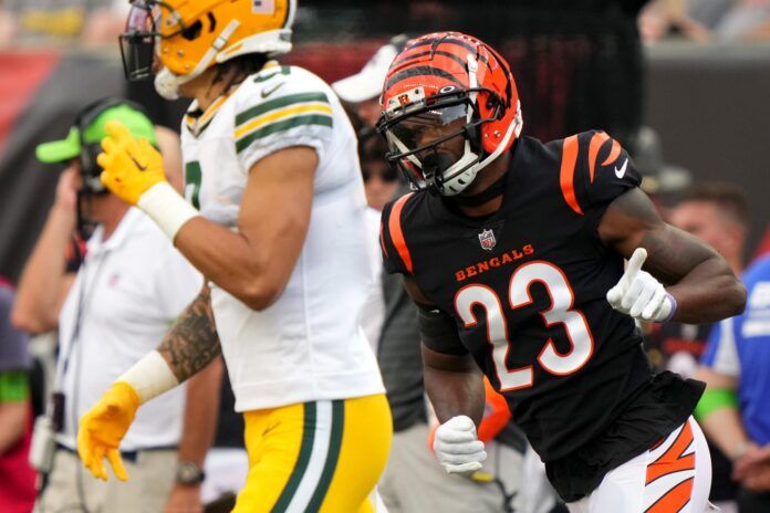 Dax Hill (23) wags his finger after breaking up a pass intended for Green Bay Packers wide receiver Christian Watson.