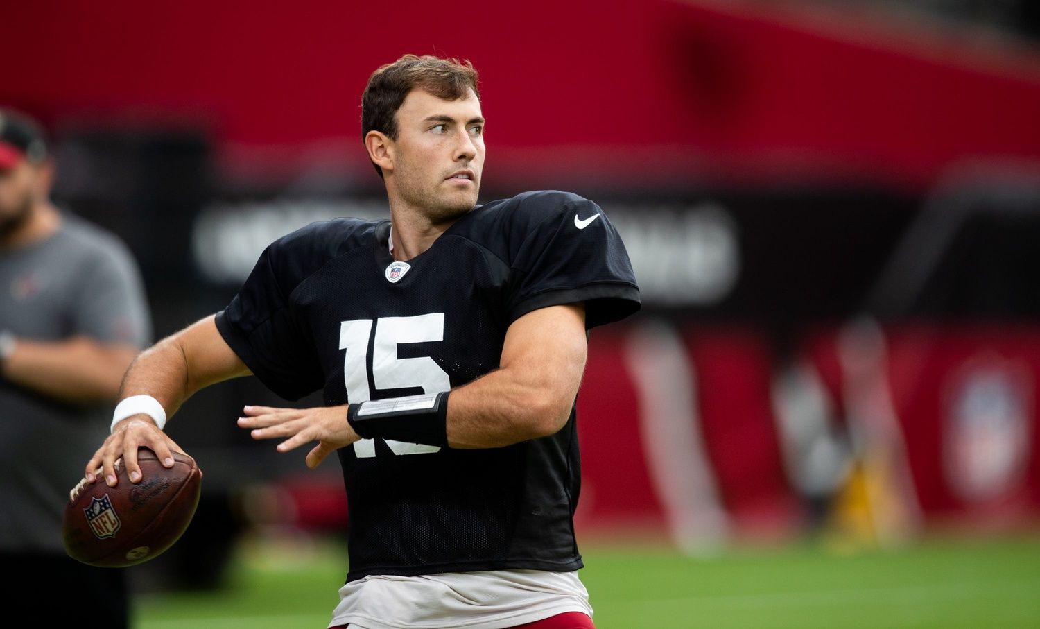 Clayton Tune throws a ball during the Arizona Cardinals' annual Red & White practice at State Farm Stadium.