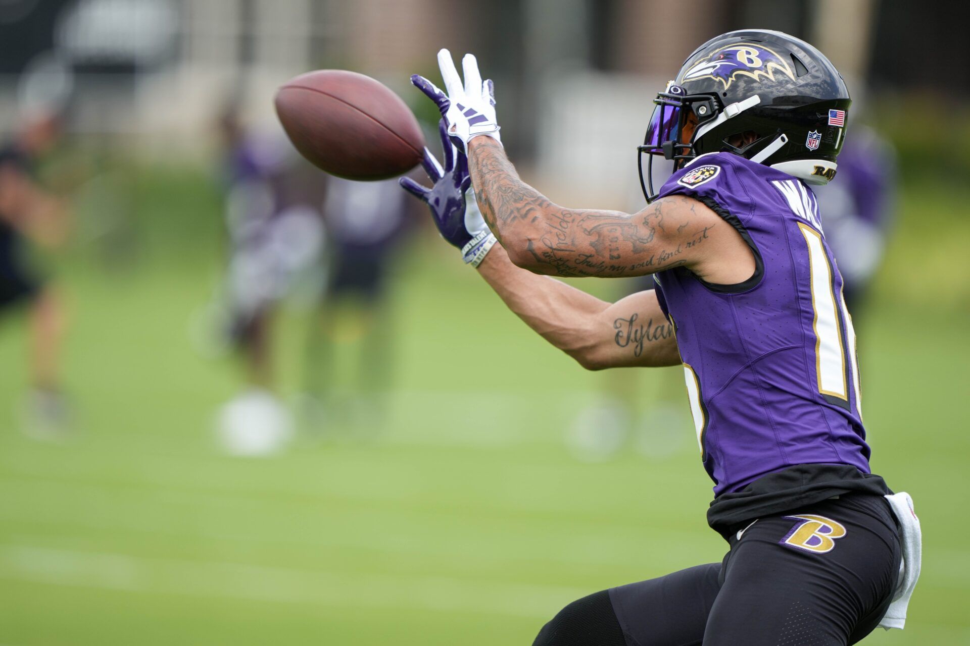 Baltimore Ravens WR Tylan Wallace (16) catches a pass during training camp practice.