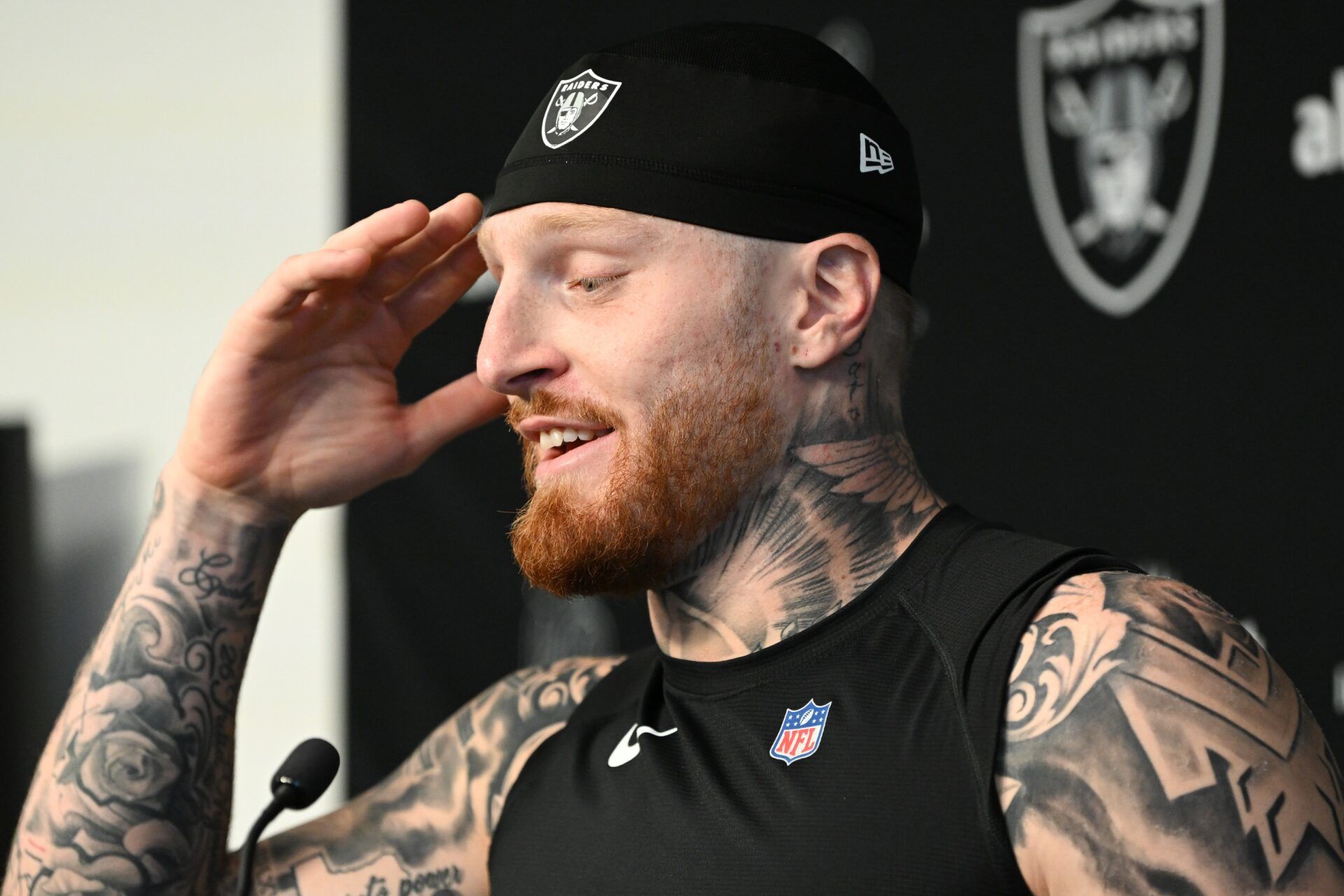 Maxx Crosby (98) speaks during a press conference during training camp at the Intermountain Health Performance Center.