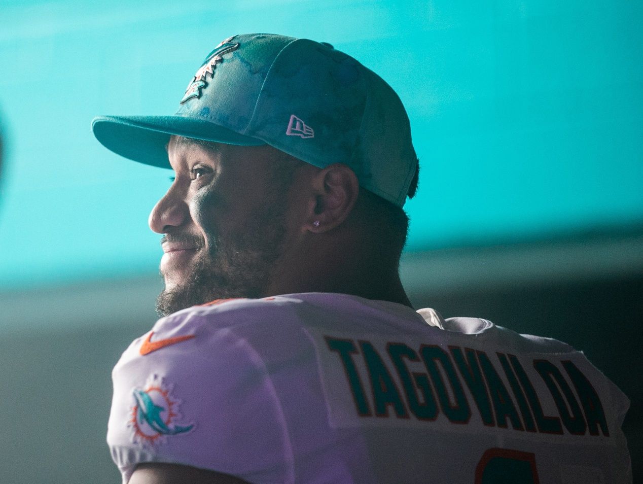 Tua Tagovailoa (1) smiles in the team tunnel prior to the start of the first half of the game between host Miami Dolphins and the Houston Texans at Hard Rock Stadium.