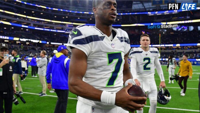 Seattle Seahawks QB Geno Smith (7) walks on the field after a game against the Los Angeles Rams.