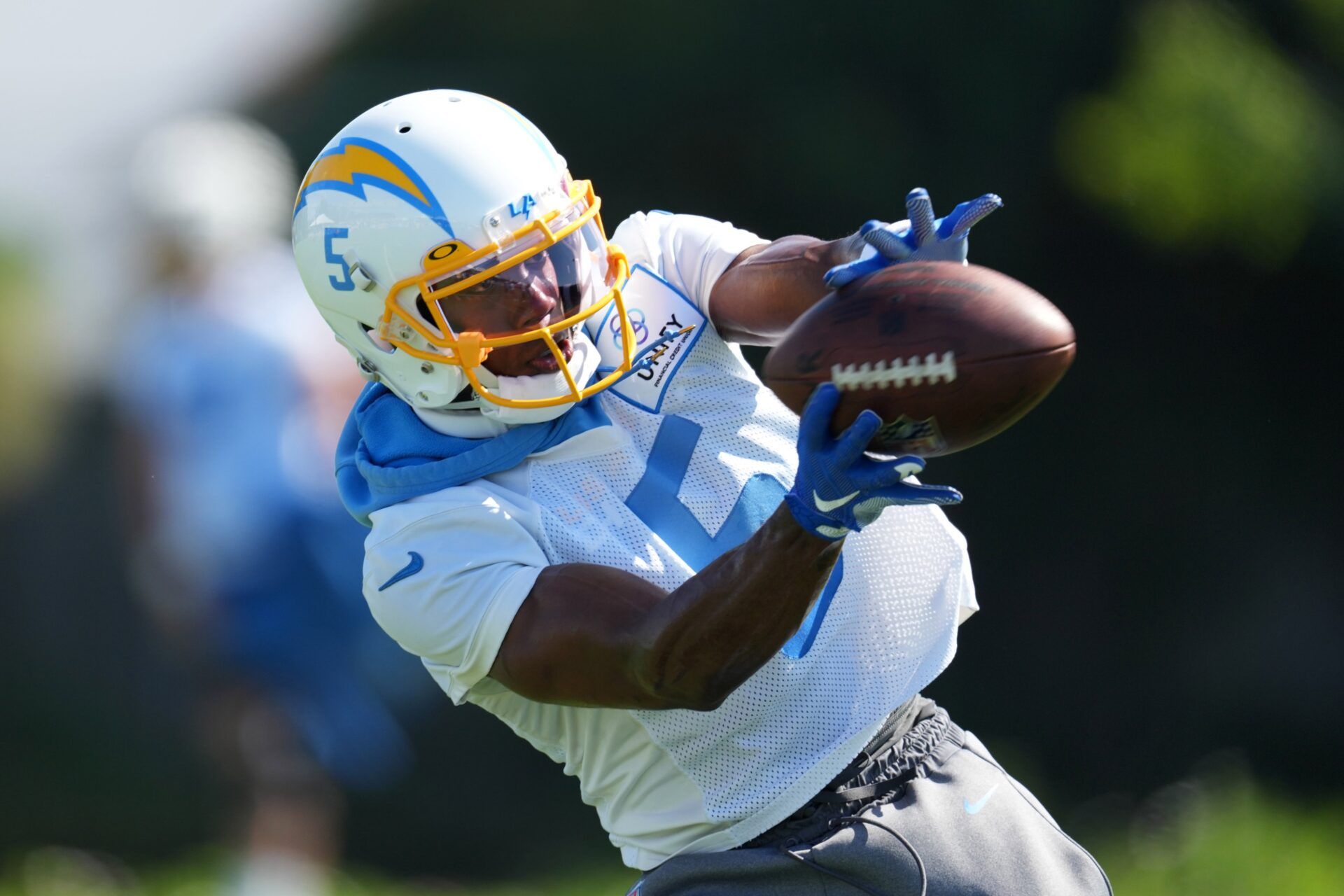 Joshua Palmer (5) catches the ball during training camp at Jack Hammett Sports Complex.