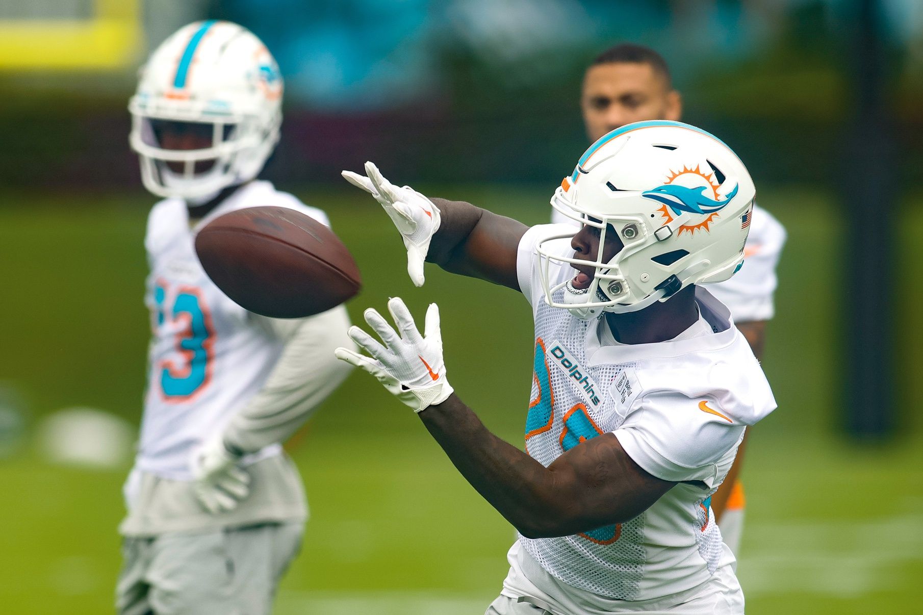 De’Von Achane (28) catches the football during mandatory minicamp at the Baptist Health Training Complex.