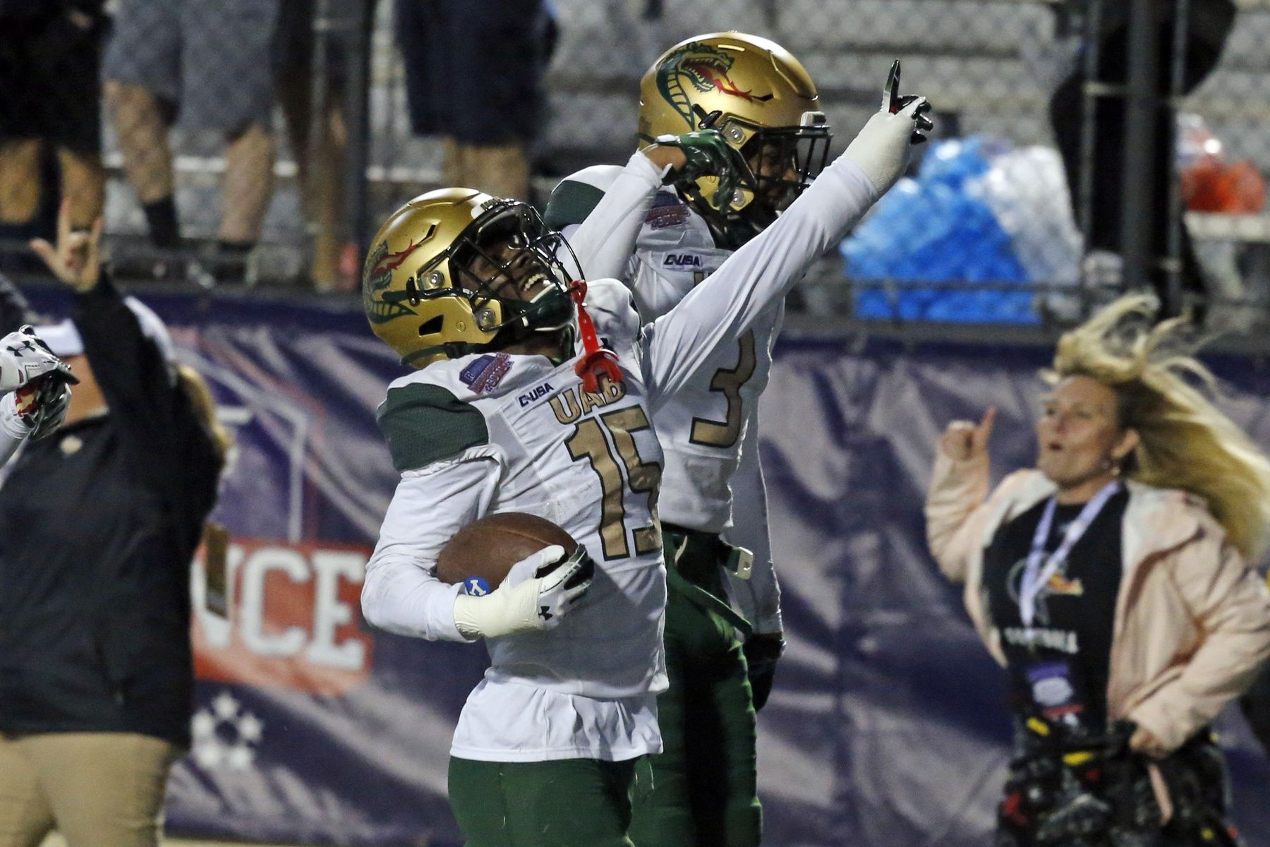 CD Daniels (right) react with defensive back Mac McWilliams (left) after a fumble recovery during during the fourth quarter against the BYU Cougars the 2021 Independence Bowl at Independence Stadium.