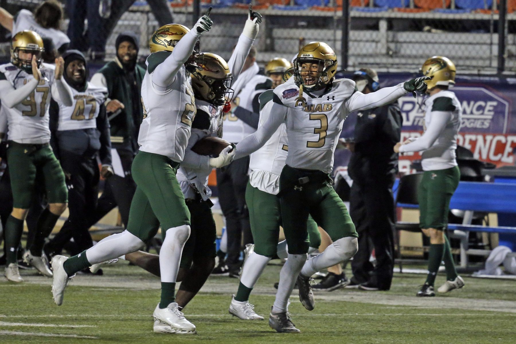 UAB Blazers defensive back Jaylen Key (left) and defensive back CD Daniels (right) react with defensive back Mac McWilliams (middle) after a fumble recovery during during the fourth quarter against the BYU Cougars the 2021 Independence Bowl at Independence Stadium.