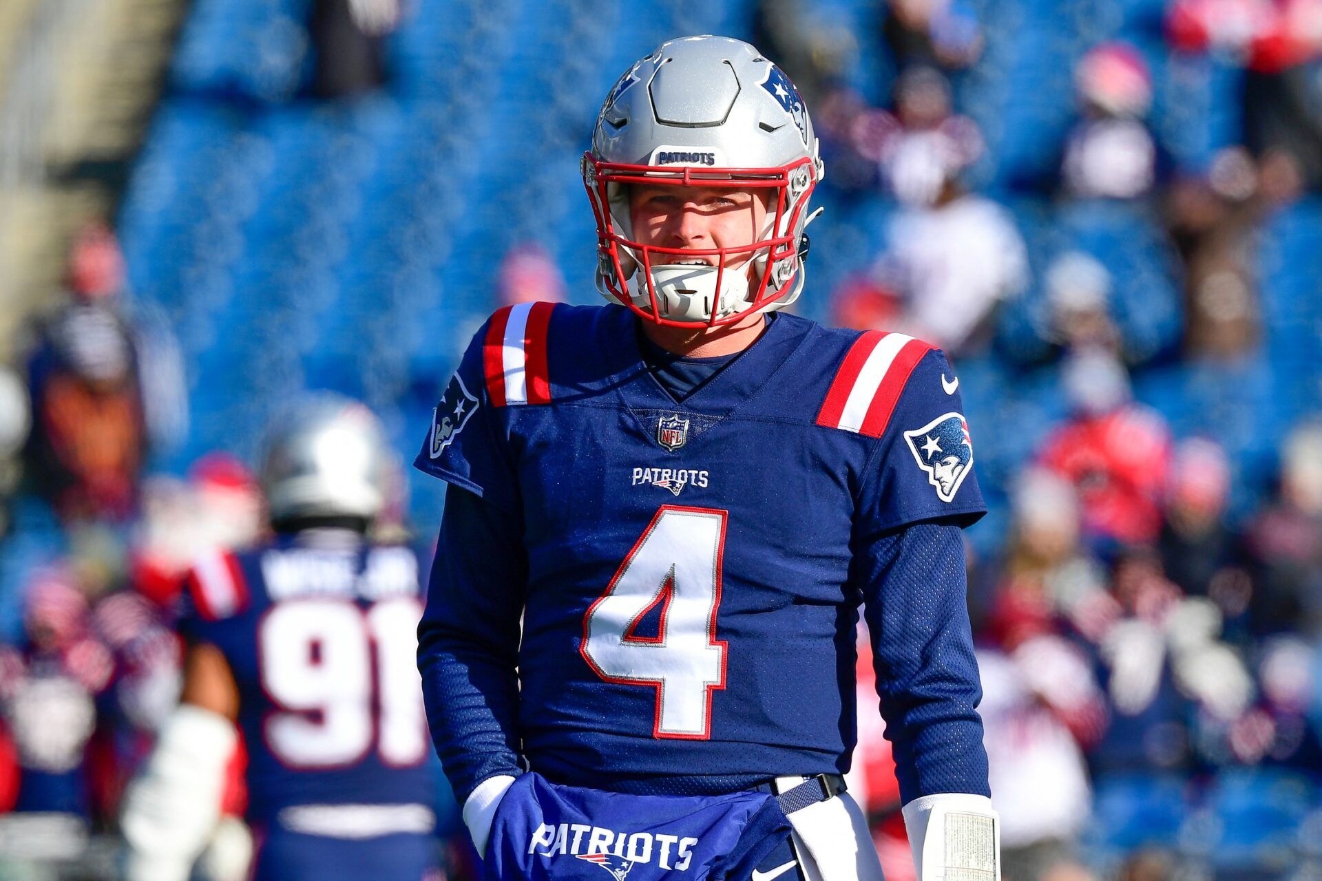 Bailey Zappe (4) warms up before the start of a game against the Cincinnati Bengals at Gillette Stadium.