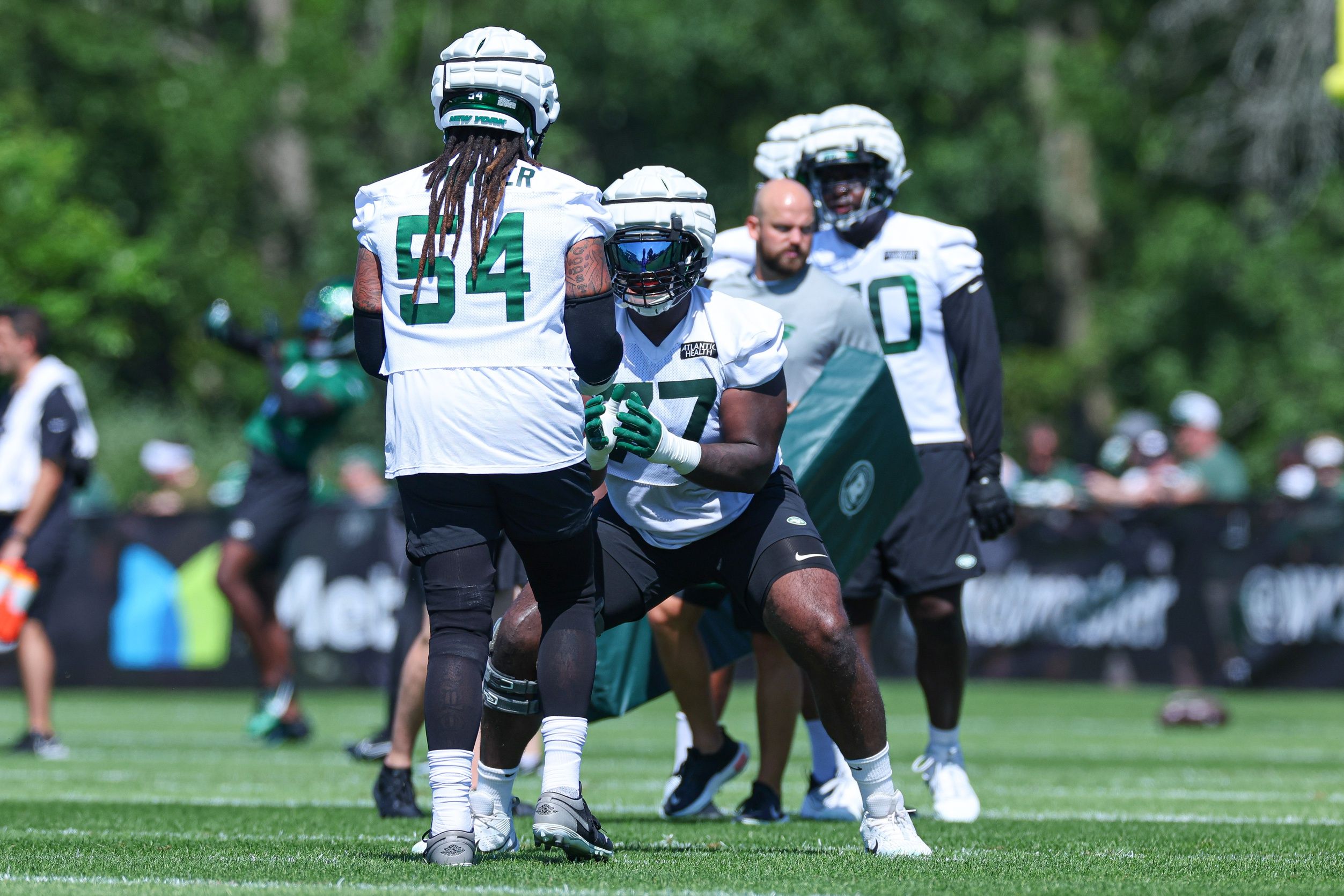 Mekhi Becton (77) drills with guard Billy Turner (54) during the New York Jets Training Camp at Atlantic Health Jets Training Center. 