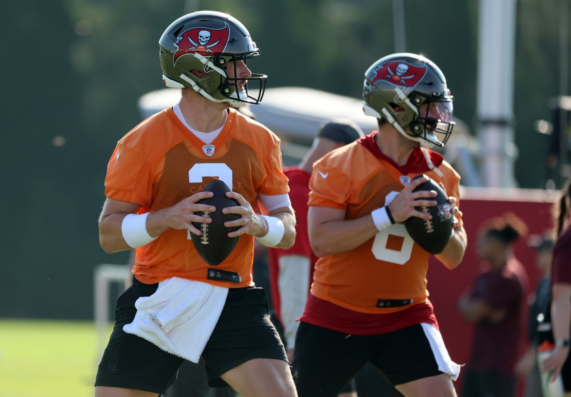 Kyle Trask (2) and Tampa Bay Buccaneers quarterback Baker Mayfield (6) work out during training camp at AdventHealth Training Center.