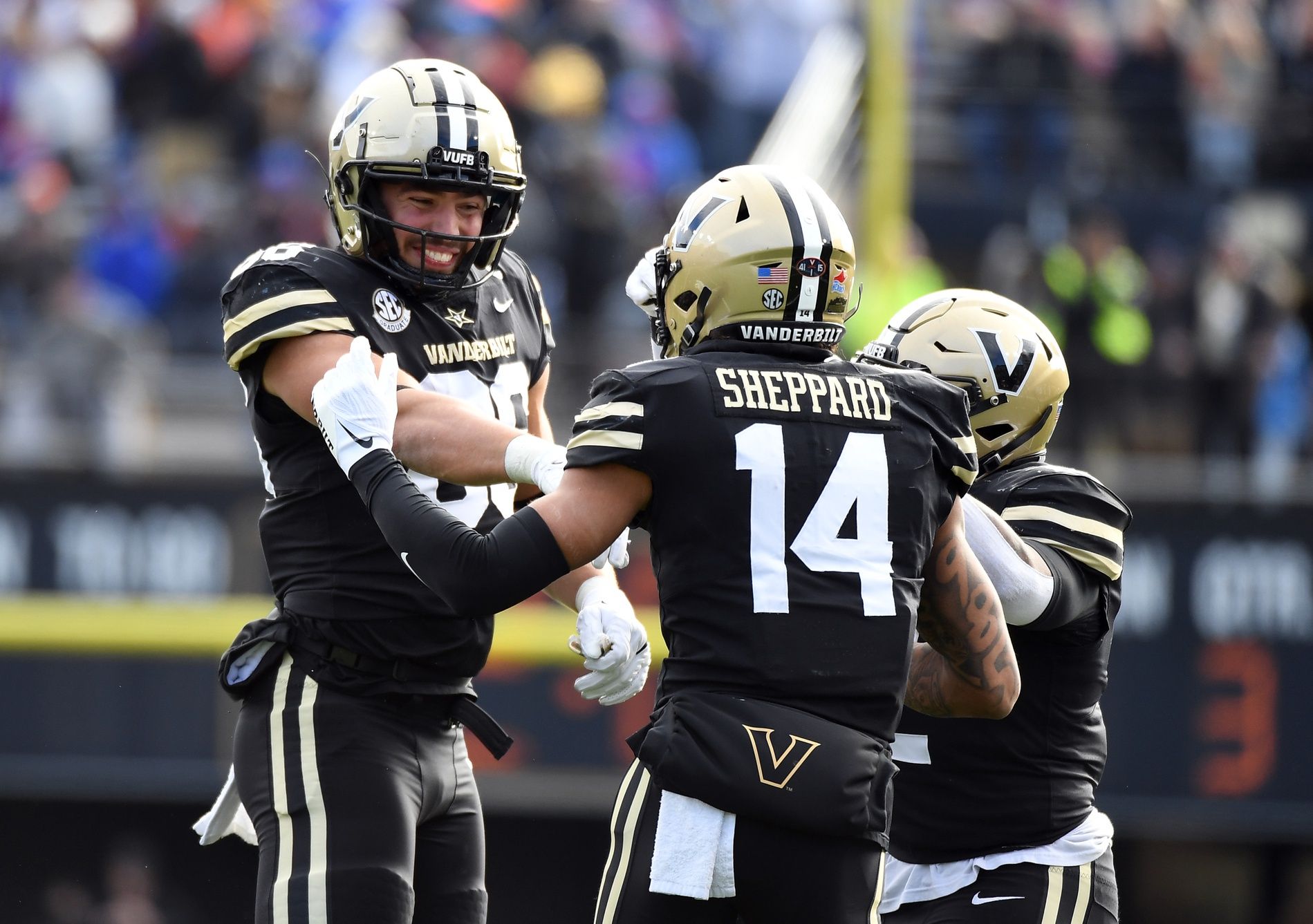 Ben Bresnahan (86) celebrates with wide receiver Will Sheppard (14) and running back Ray Davis (2) after a touchdown during the second half against the Florida Gators at FirstBank Stadium.