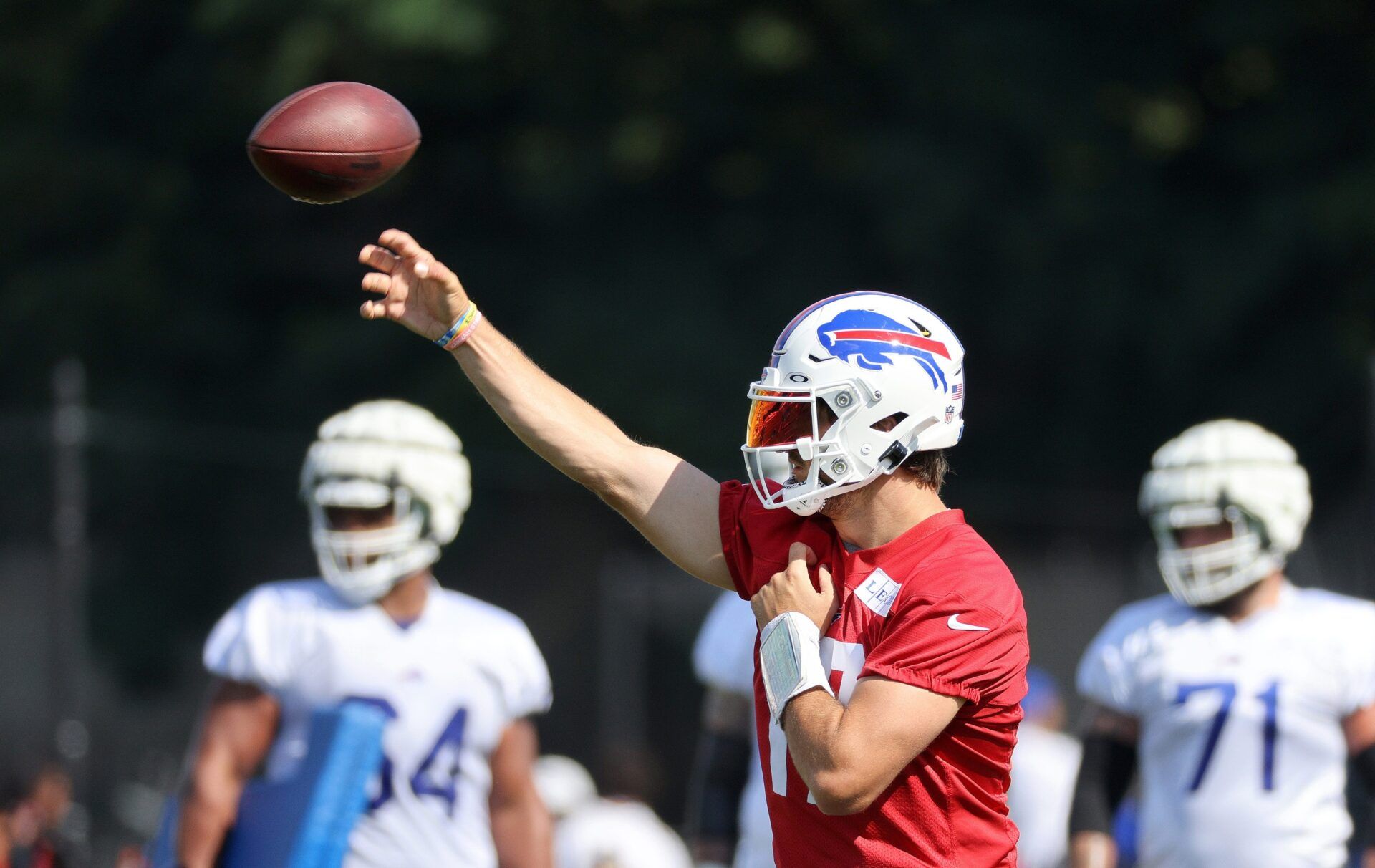 Buffalo Bills QB Josh Allen (17) throws passes during training camp.