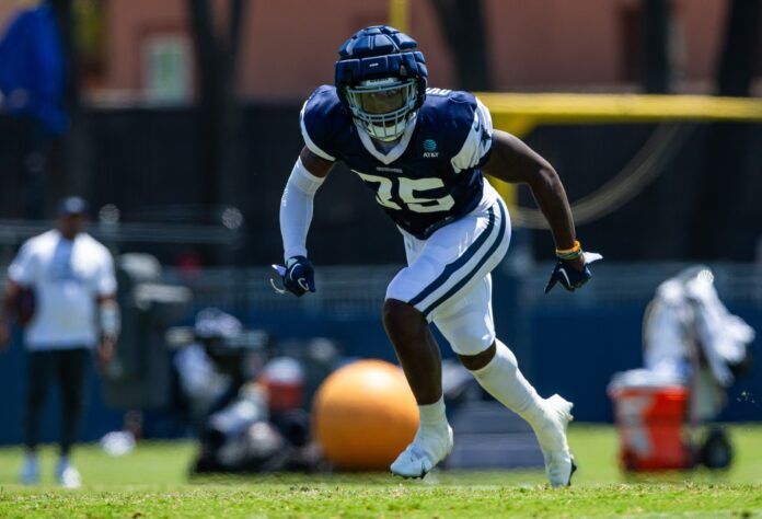 DeMarvion Overshown (35) runs during training camp at Marriott Residence Inn-River Ridge playing fields.