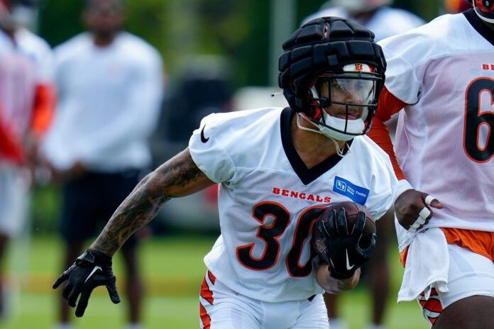 Chase Brown (30) runs with the ball during a training camp practice at the Paycor Stadium practice field in downtown Cincinnati.