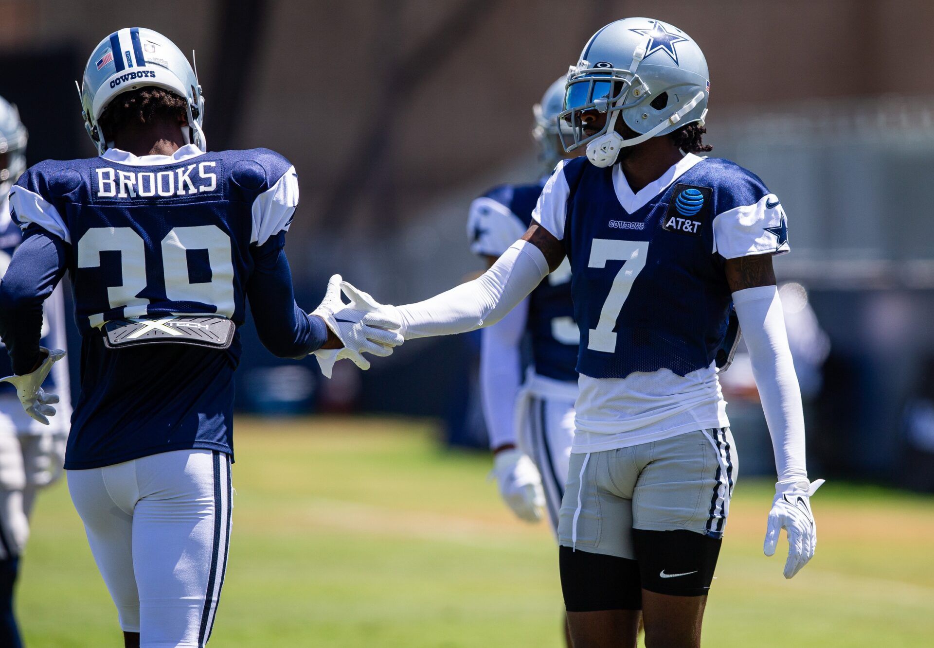 Dallas Cowboys CB Trevon Diggs (7) congratulates CB Myles Brooks (39) after a play during drills.