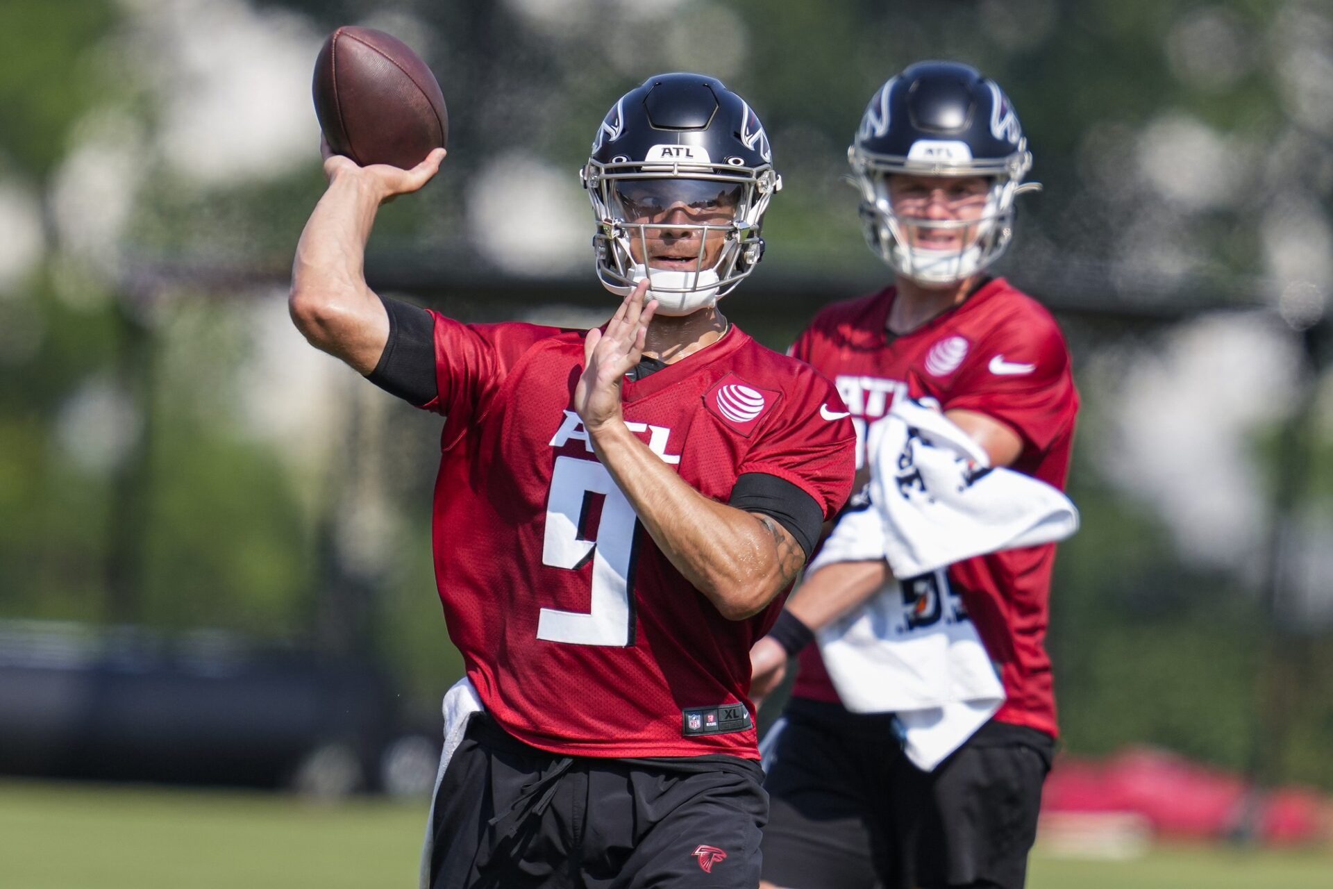 Atlanta Falcons QB Desmond Ridder (9) throws passes during training camp.