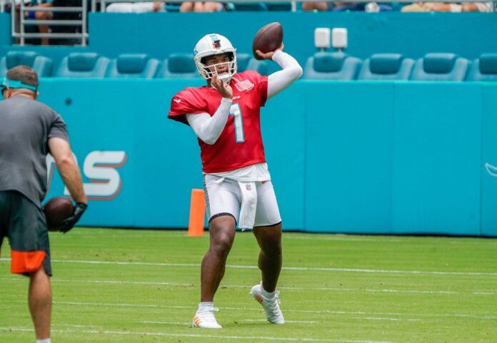 Miami Dolphins QB Tua Tagovailoa (1) throws passes during training camp.