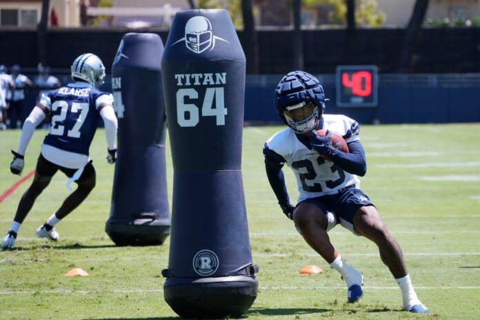 Dallas Cowboys RB Rico Dowdle (23) performs drills during training camp.