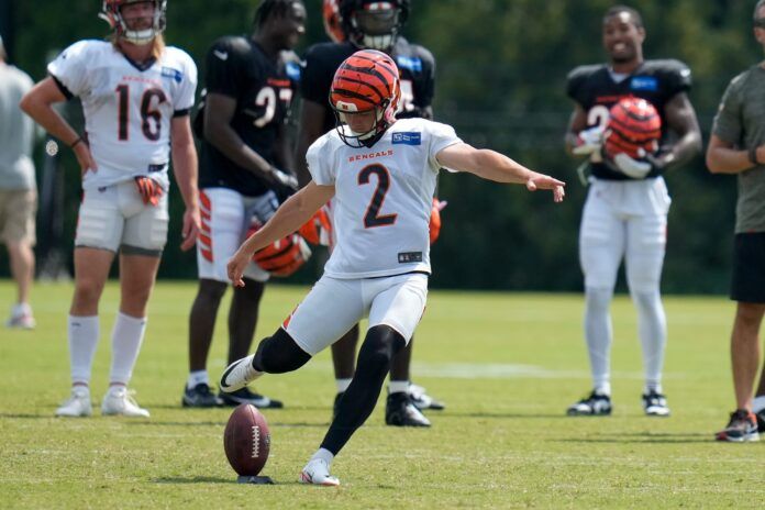 Evan McPherson (2) kicks off during a training camp practice at the Paycor Stadium practice field in downtown Cincinnati.