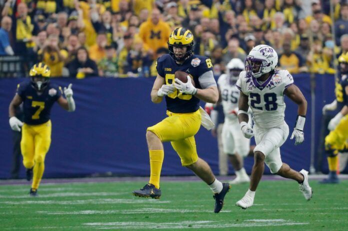 Michigan Wolverines TE Luke Schoonmaker (86) runs after the catch against the TCU Horned Frogs in the College Football Playoff.