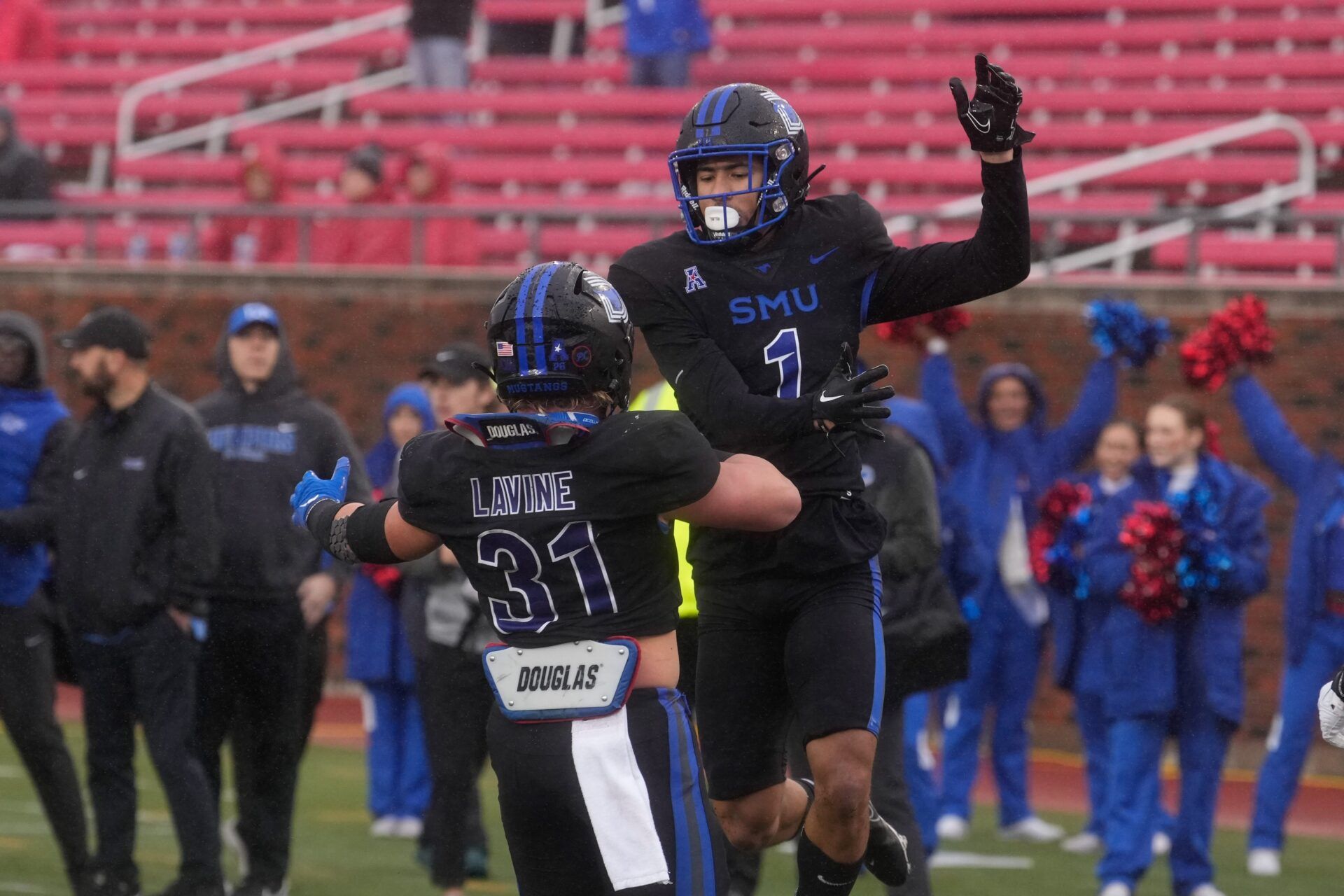 Jordan Kerley (1) celebrates with Southern Methodist Mustangs running back Tyler Lavine (31) after scoring a touchdown against the Memphis Tigers during the first half at Gerald J. Ford Stadium.