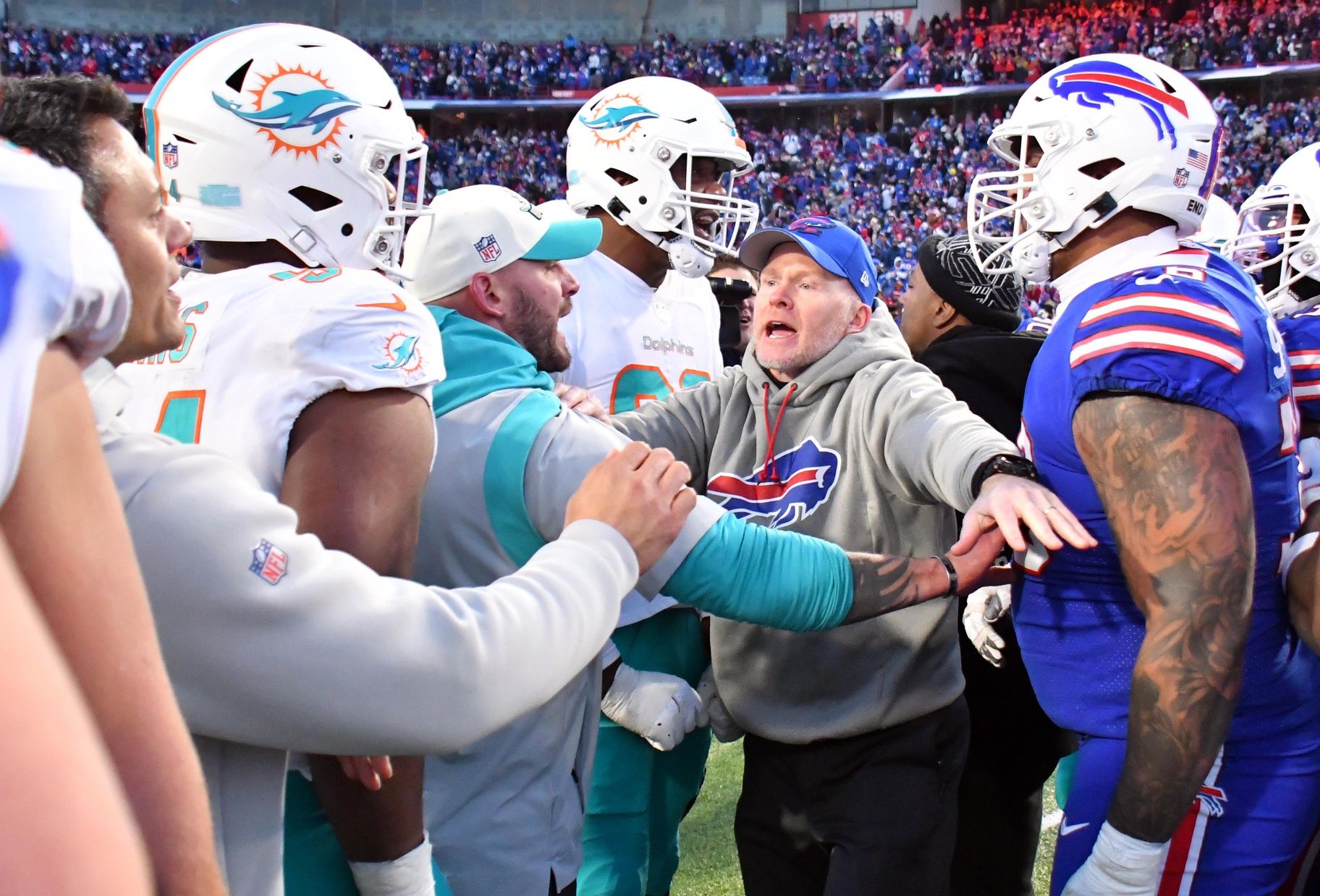 Buffalo Bills and Miami Dolphins players and coaches have words with each other following their Wild Card matchup.