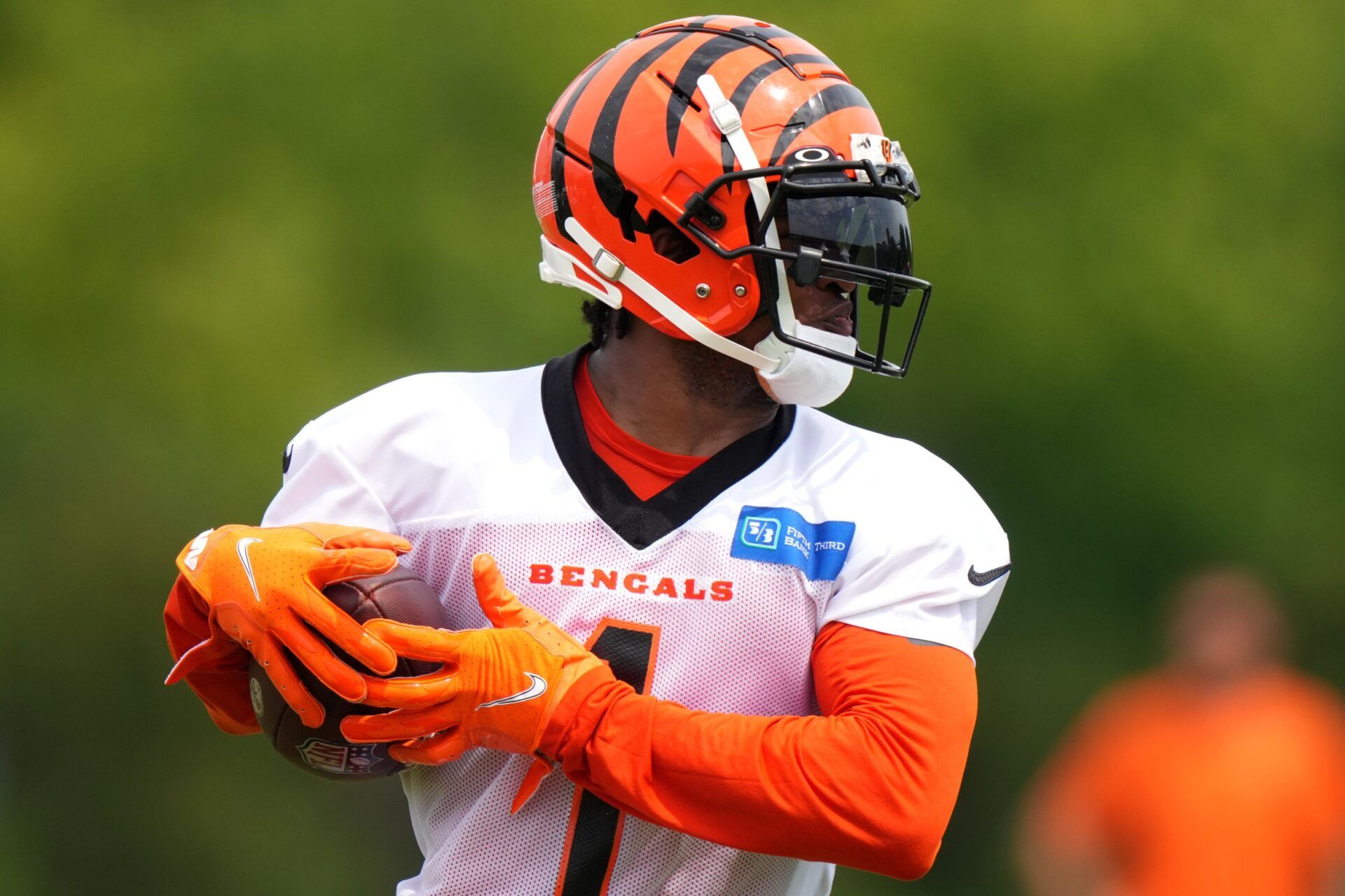 Ja'Marr Chase (1) turns downfield after completing a catch during the team’s training camp practice.
