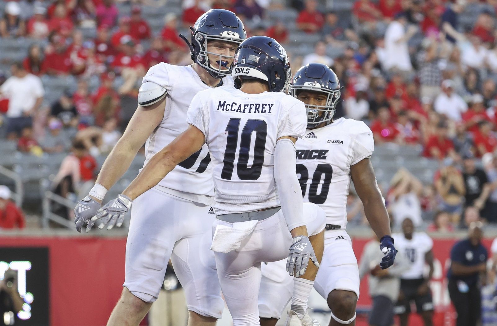 Luke McCaffrey (10) celebrates with tight end Jack Bradley (87) after scoring a touchdown during the third quarter against the Houston Cougars at TDECU Stadium.