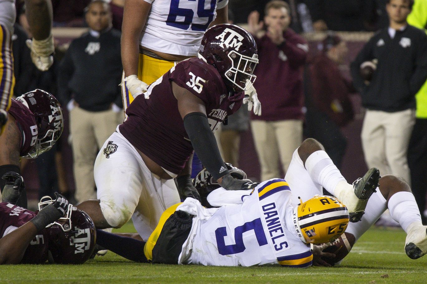 McKinnley Jackson (35) tackles LSU Tigers quarterback Jayden Daniels (5) on a two point conversion attempt during the second half at Kyle Field.