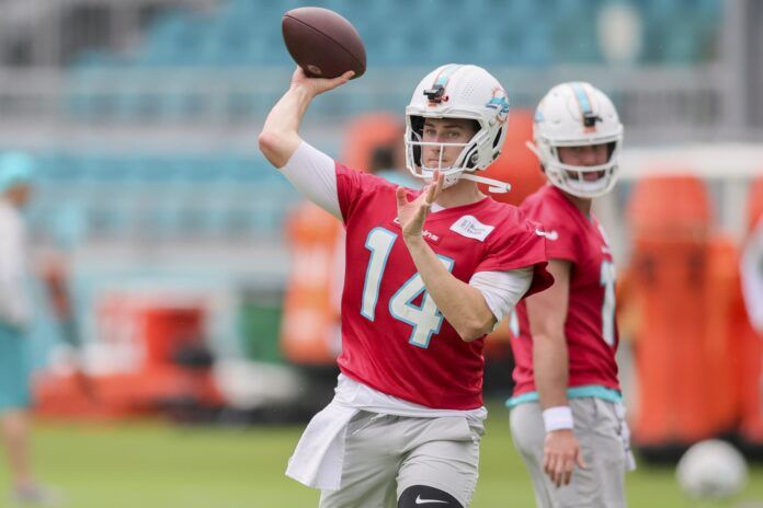 Mike White (14) works out during training camp at Baptist Health Training Facility.