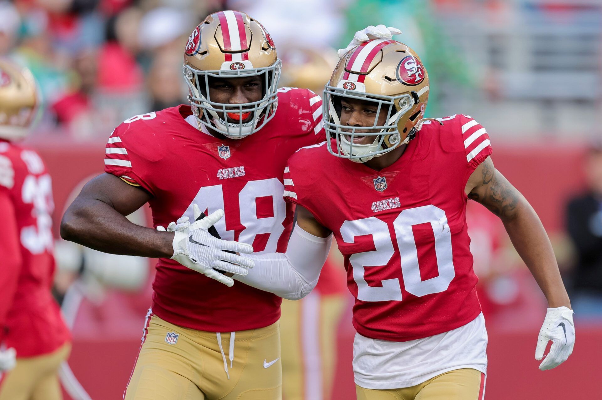 Oren Burks (48) celebrates with cornerback Ambry Thomas (20) after a play during the first quarter against the Miami Dolphins at Levi's Stadium.