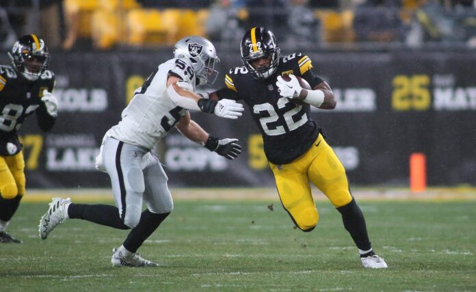 Pittsburgh Steelers RB Najee Harris (22) stiff-arms Las Vegas Raiders Luke Masterson (59).