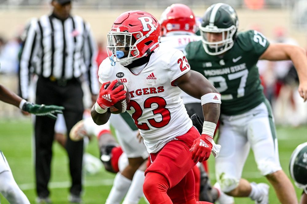 Rutgers Scarlet Knights RB Kyle Monangai (23) rushes the ball against the Michigan State Spartans.