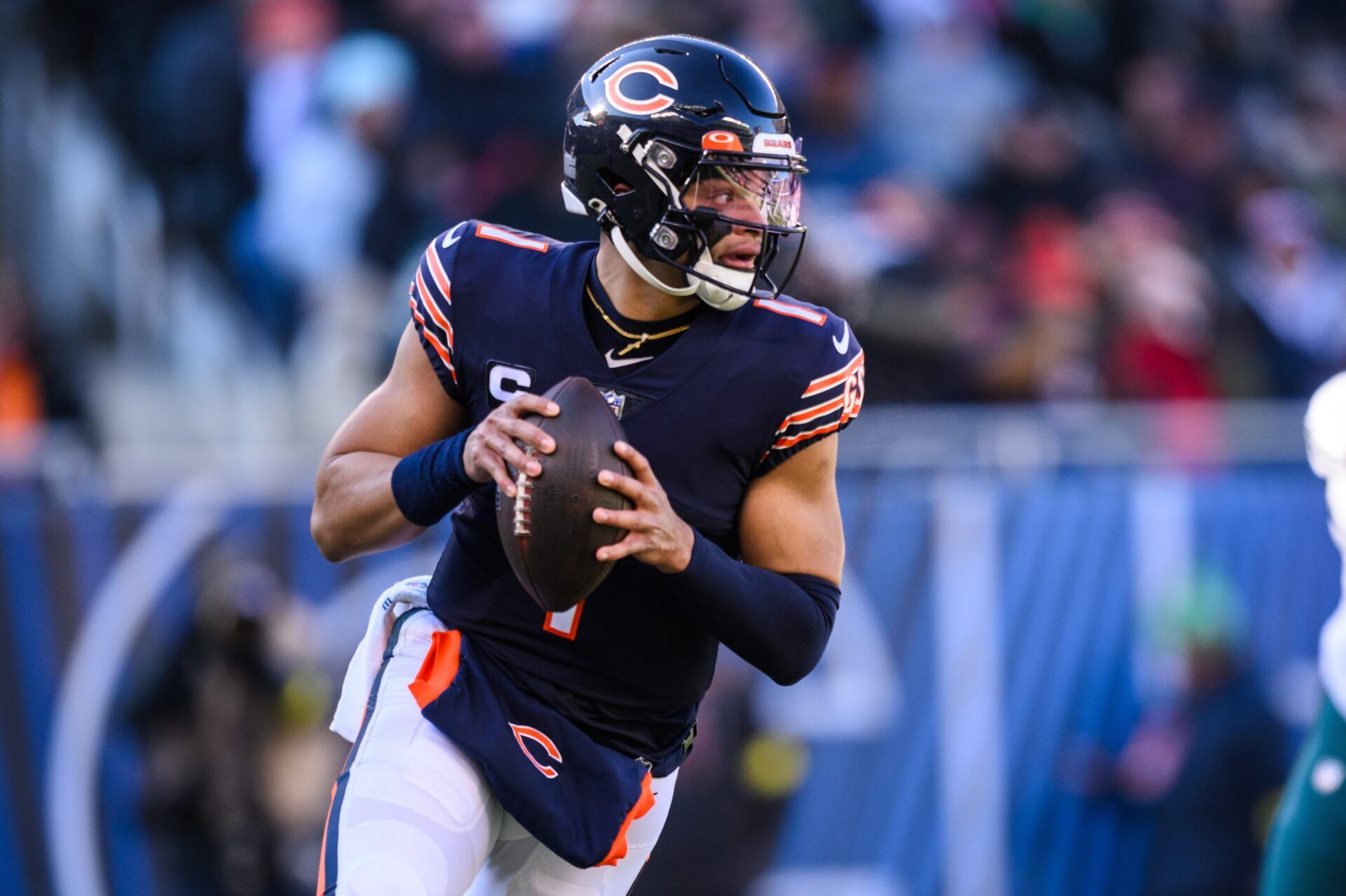 Justin Fields (1) looks to pass in the first quarter against the Philadelphia Eagles at Soldier Field.