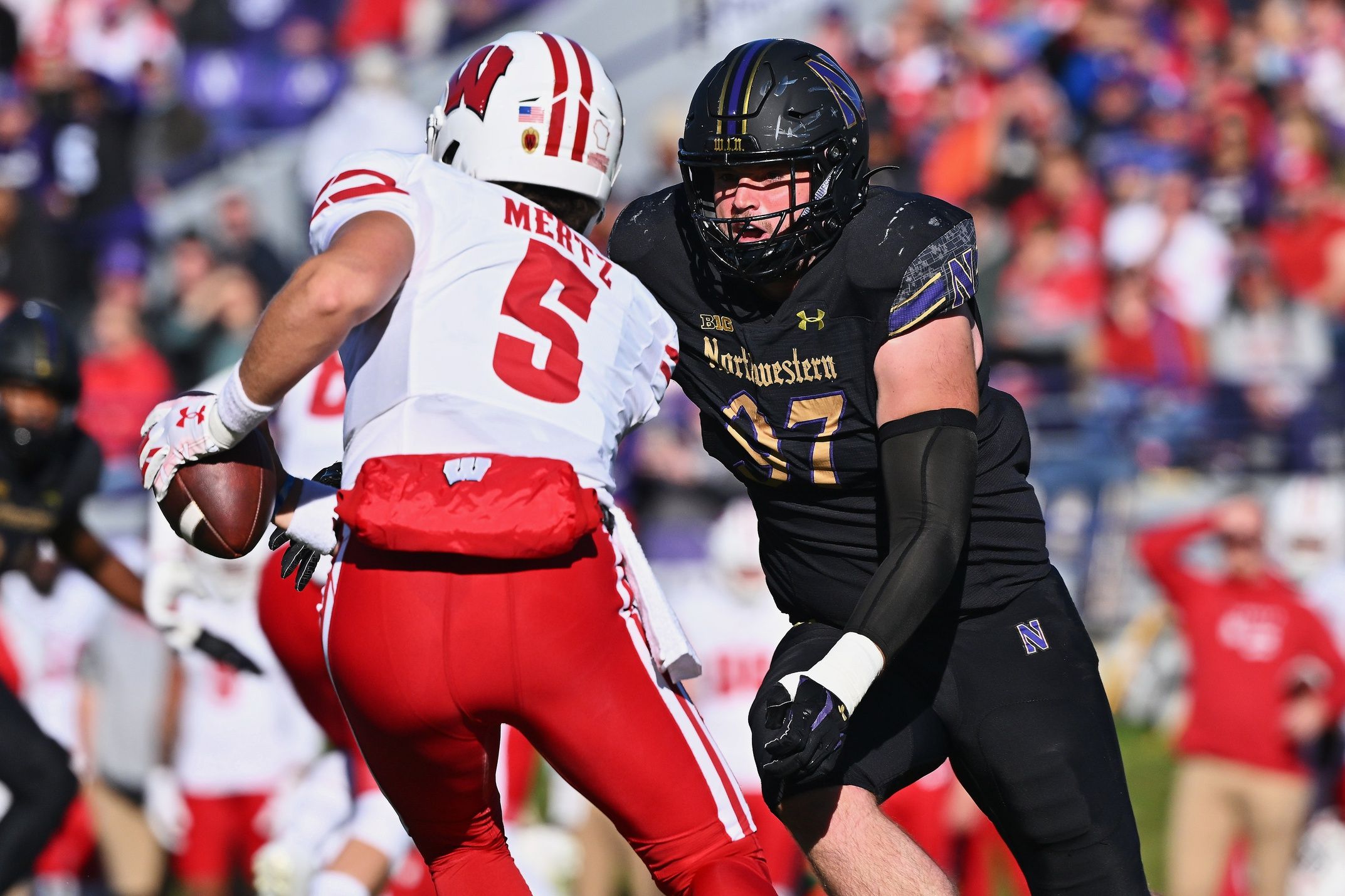 Sean McLaughlin (97) chases down the quarterback against the Wisconsin Badgers at Ryan Field.