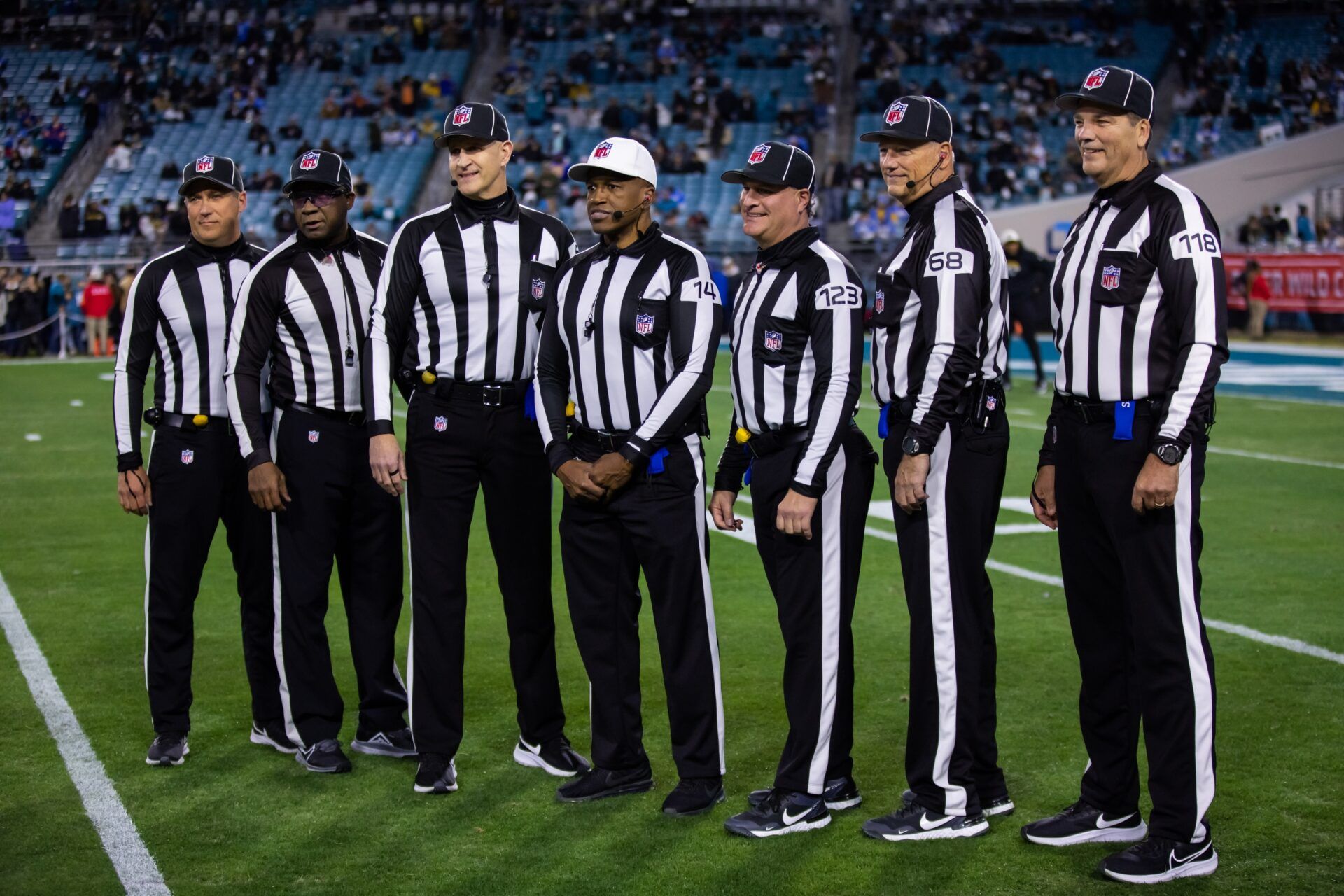 NFL referee Shawn Smith (14) and his crew of Barry Anderson, Tom Stephan, Michael Dolce, Joe Blubaugh, David Meslow, Tony Josselyn pose for a team photo prior to the Los Angeles Chargers game against the Jacksonville Jaguars during a wild card playoff game at TIAA Bank Field.