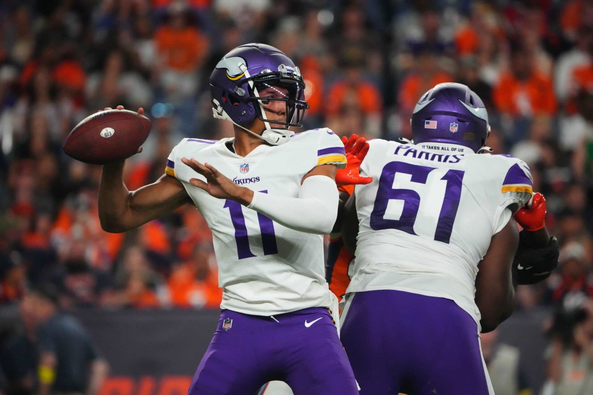 Kellen Mond (11) prepares to pass in the second half against the Denver Broncos at Empower Field at Mile High.