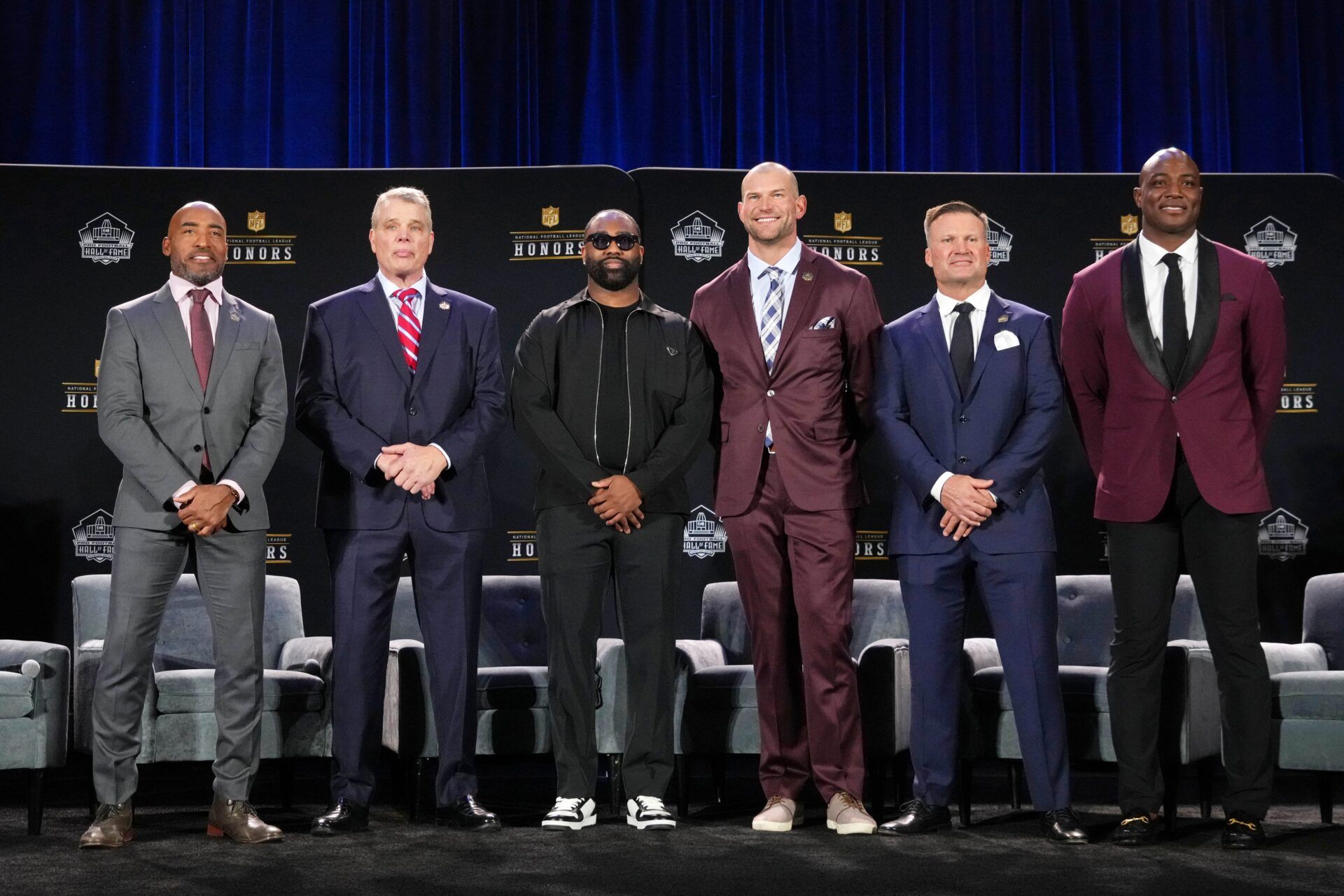 Members of the 2023 Pro Football Hall of Fame class pose for pictures in Phoenix, Arizona.