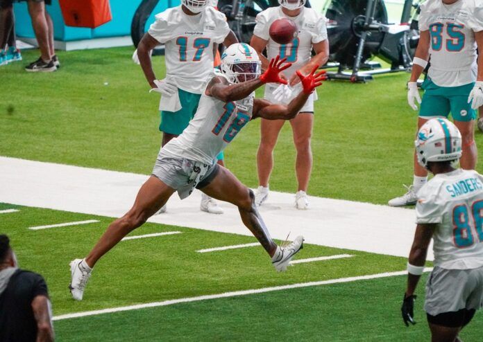 Miami Dolphins WR Erik Ezukanma (18) catches a pass during training camp.