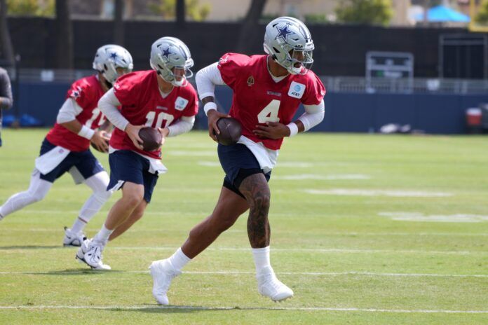 Dak Prescott (4) takes the snap during training camp at the River Ridge Fields.