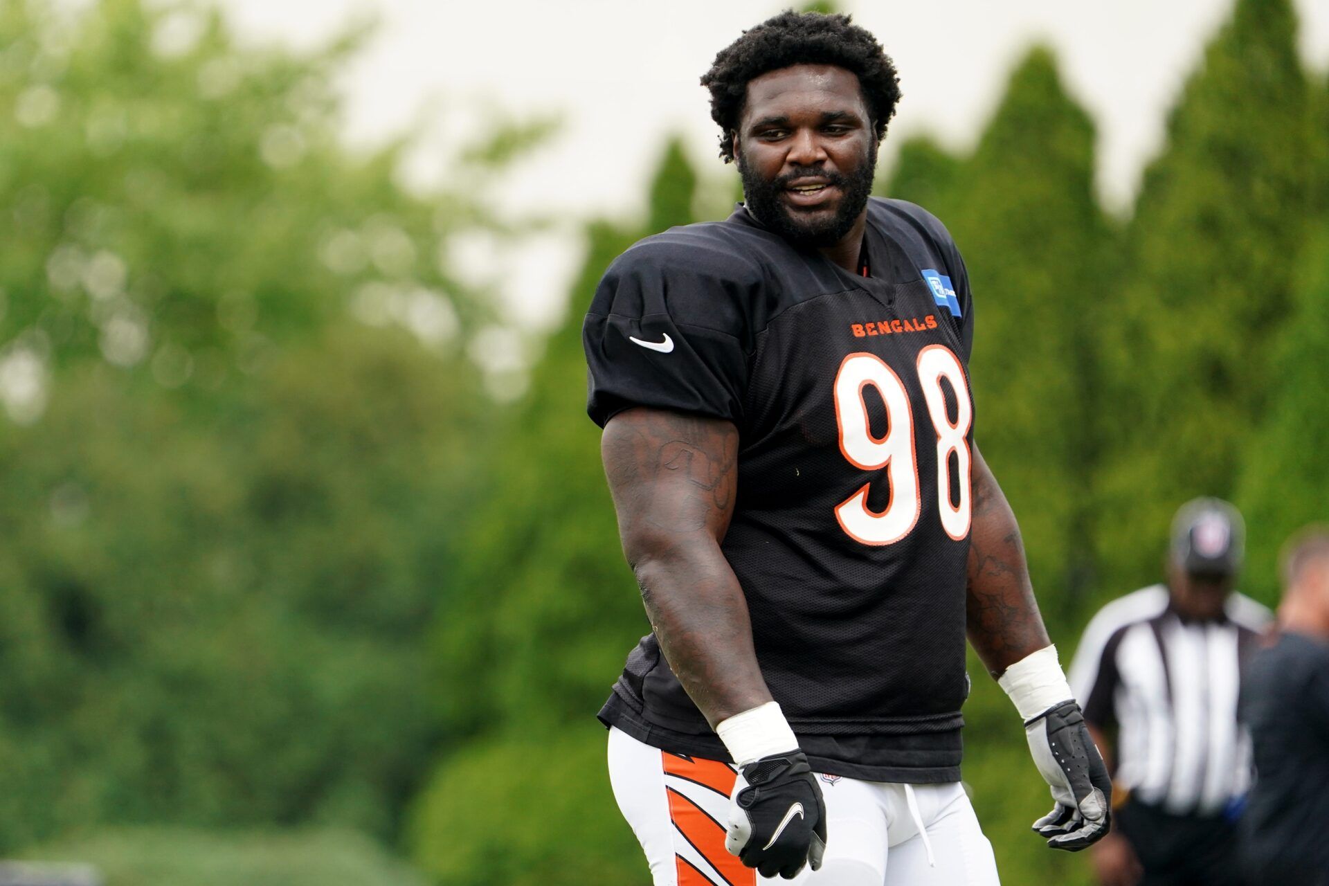D.J. Reader (98) walks with teammates during Cincinnati Bengals training camp practice.