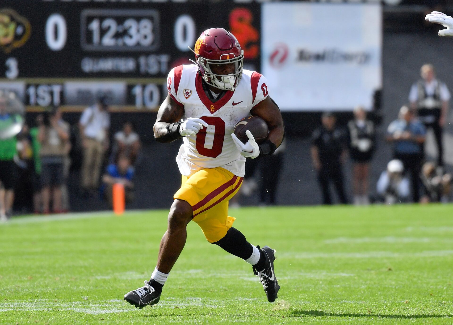 USC Trojans running back MarShawn Lloyd (0) turns it up field on the way for a touchdown in the first quarter against the Colorado Buffaloes at Folsom Field.