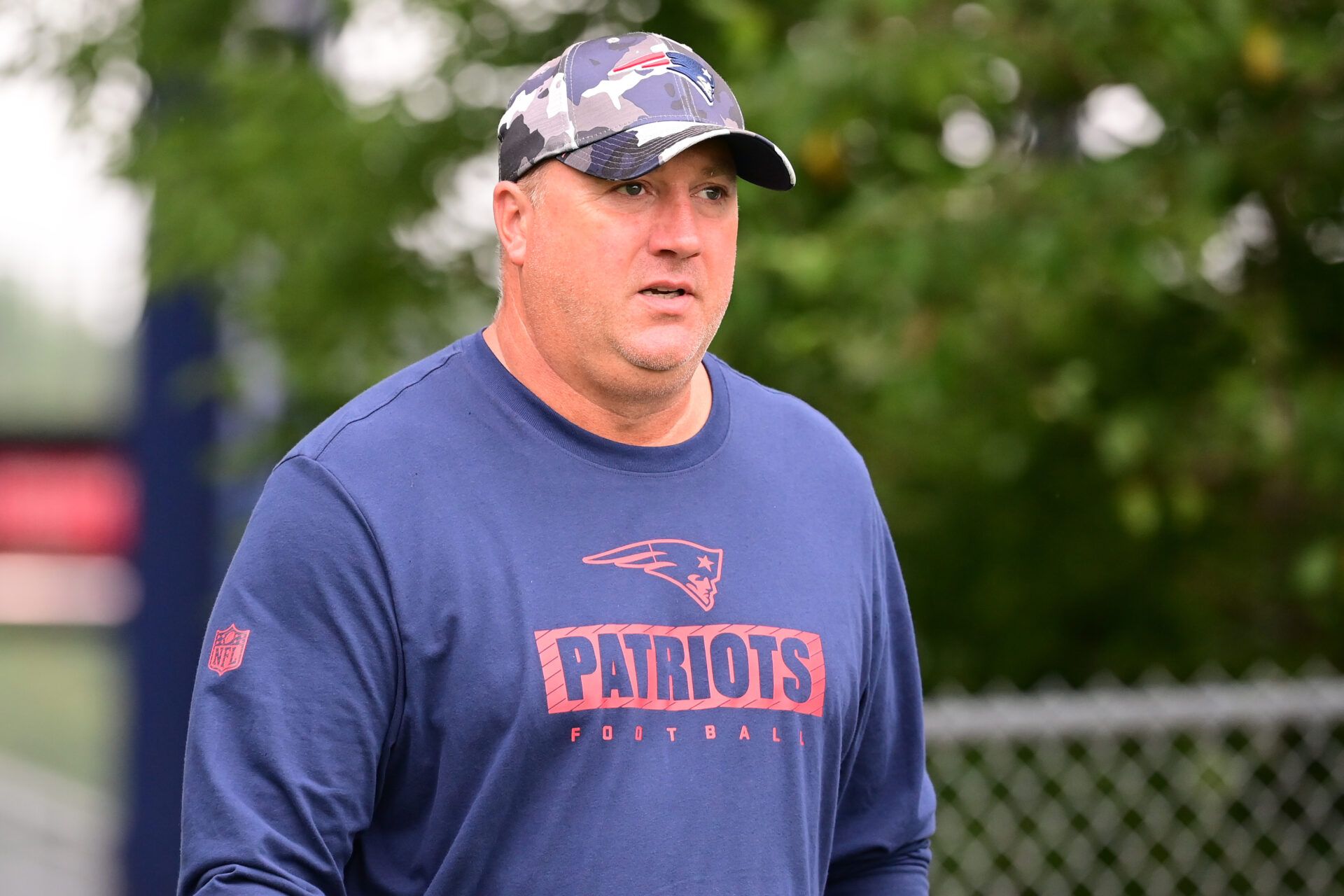 Jul 24, 2024; Foxborough, MA, USA; New England Patriots offensive coordinator Alex Van Pelt walks to the practice fields during training camp at Gillette Stadium. Mandatory Credit: Eric Canha-USA TODAY Sports
