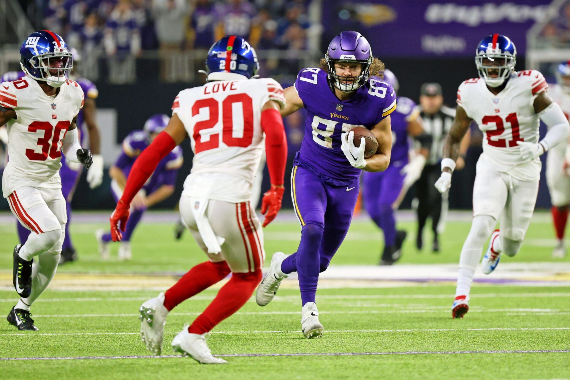 Minnesota Vikings tight end T.J. Hockenson (87) runs with the ball against the New York Giants during the second quarter of a wild card game at U.S. Bank Stadium.