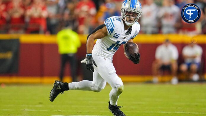 Detroit Lions wide receiver Amon-Ra St. Brown (14) runs with the ball during the second half against the Kansas City Chiefs at GEHA Field at Arrowhead Stadium.